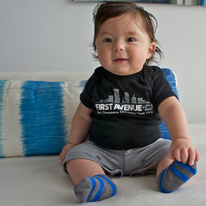 Black onesie with First Avenue logo screenprinted in white on chest