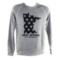 A gray crewneck sweatshirt with an image of the state of Minnesota with stars and "First Avenue Est. 1970 Minneapolis" underneath screenprinted in black. 