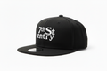 7th St Entry Flatbill - black flatbill baseball hat with the 7th St Entry logo embroidered on the front in white