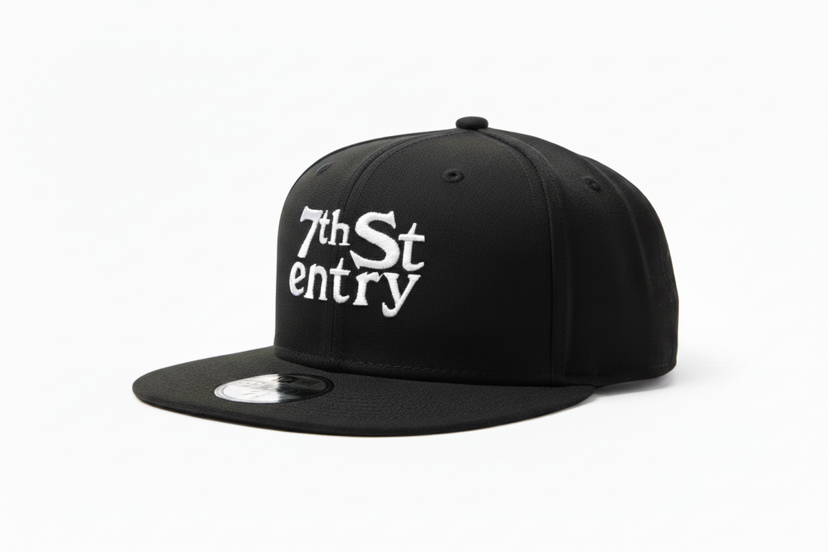 7th St Entry Flatbill - black flatbill baseball hat with the 7th St Entry logo embroidered on the front in white