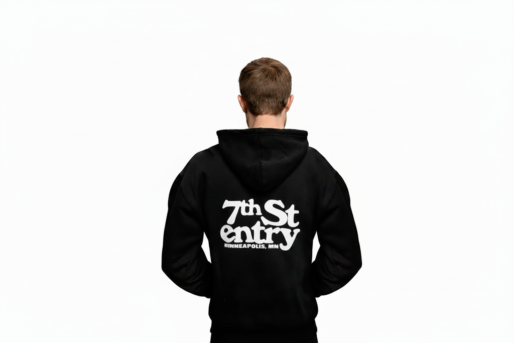 First Avenue Zip-Up Hoodie Back - with the 7th St Entry logo screenprinted in white on the back. Also has the logo screenprinted in white on the chest pocket area on the front.