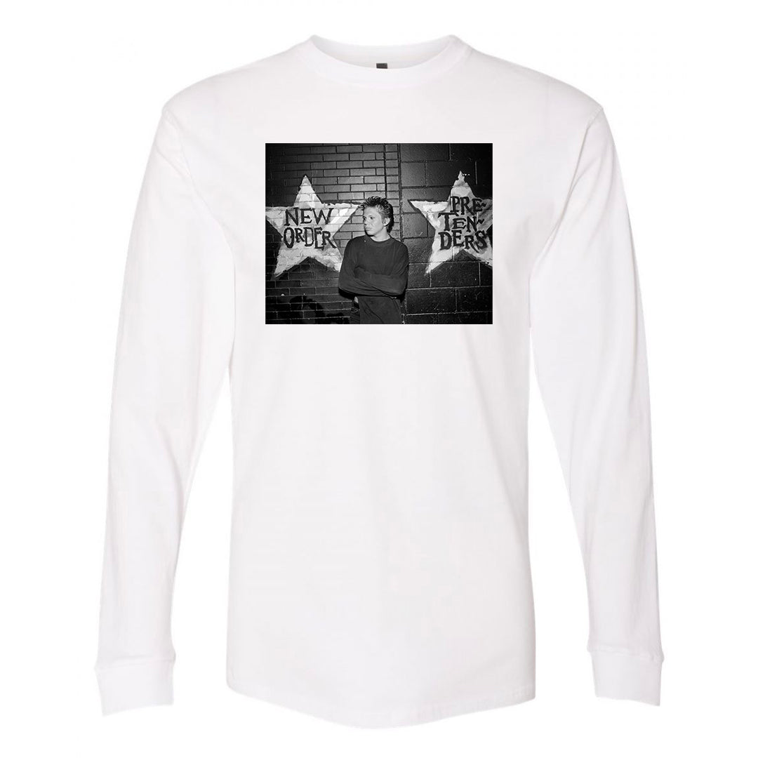 White long-sleeve shirt with an Alec Soth photo of a person outside First Avenue between two stars.