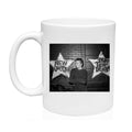 White mug with a black and white Alec Soth photo of a person in front of First Avenue with 'New Order' and 'The Pretenders' stars.