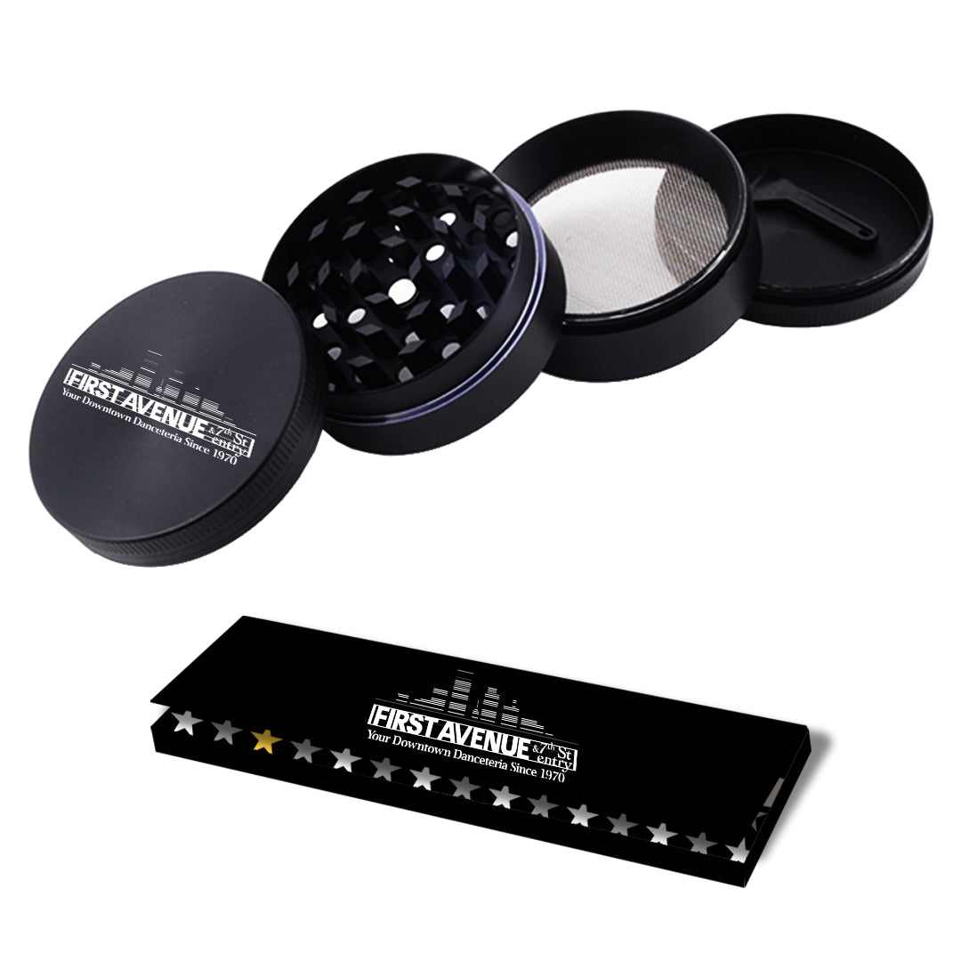 Black grinder with mesh screen branded 'First Avenue'.