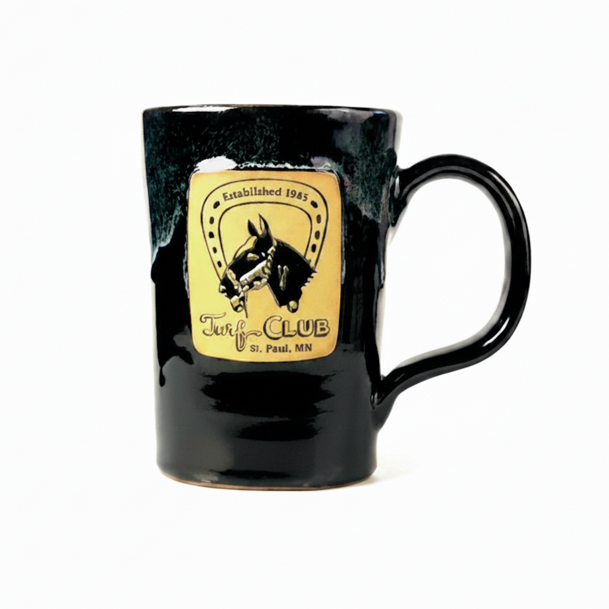 A glossy black stoneware mug with a distressed, textured glaze and a pottery-toned 'Turf Club' logo on the front.