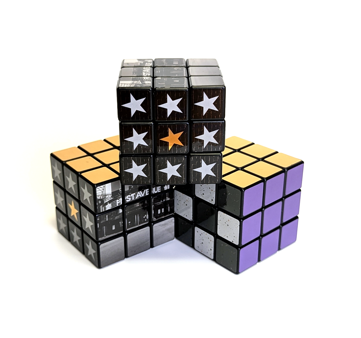 First Avenue Rubiks Cubes with star patterns, photo of the building, and purple squares.