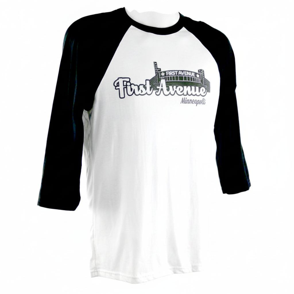 First Avenue Baseball Tee in white with black 3/4 length sleeves. Has stylized "First Avenue Minneapolis" along with a cartoon image of the building. 

Runs small.