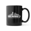 First Avenue Mug in black with the First Avenue logo in white.