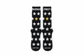 First Avenue x Hippy Feet Socks - black socks with gold and silver stars. "FIRST AVENUE' is along the top of each sock.