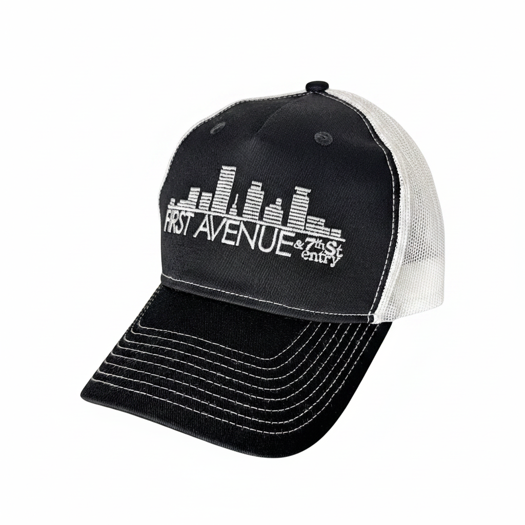 Trucker Hat in black (front) and white (mesh back) with the First Avenue logo embroidered in white on the front.