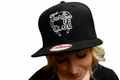 Turf Club Flatbill hat in black with stylized "TURF CLUB" and a horseshoe embroidered in white on the front.