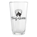 A clear glass pint glass featuring a black printed logo with a horse head inside a horseshoe and the words 'Turf CLUB'